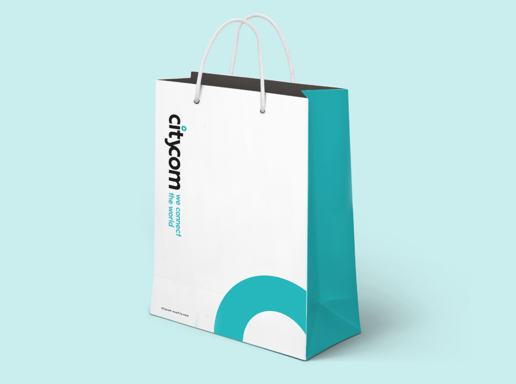 Citycom Tasche mit Logo und Markenfarben in Türkis und Weiß.